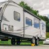 imageCamco CamperRV Curved Trailer Aid  Features 65quot of Lift ampamp Includes Wheel Chock and Rubber Base Pad  Designed for Trailers Up to 20000lbs ampamp Compatible w Tires Up to 32quot 44436