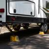 imageCamco Dual Standard RV Wheel Chock wRope  Heavy Duty Trailer Wheel Chock Constructed of Durable Plastic wUV inhibitors  Features Rope Handle for Easy Removal  Use wTires Up to 26in  44470Large w Rope